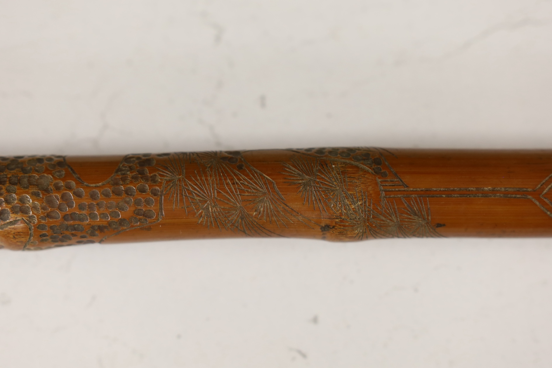 A Japanese carved and signed walking cane, 87cm high. Condition - fair to good